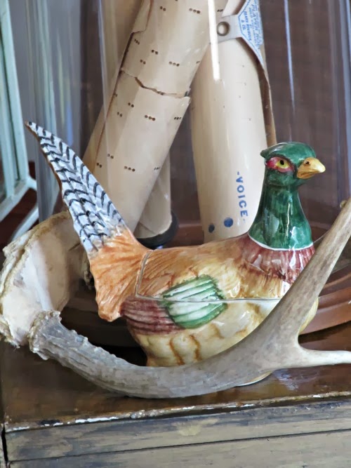peasant statue and antlers. 
