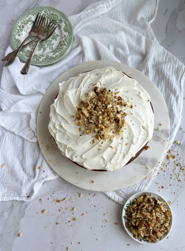 Ina Garten old fashioned banana cake cut into 3 pieces on green and white transfer ware plates.