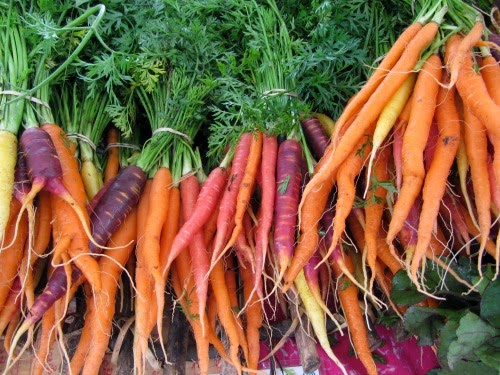 Colorful carrots at the farmers market, spring self care ideas.