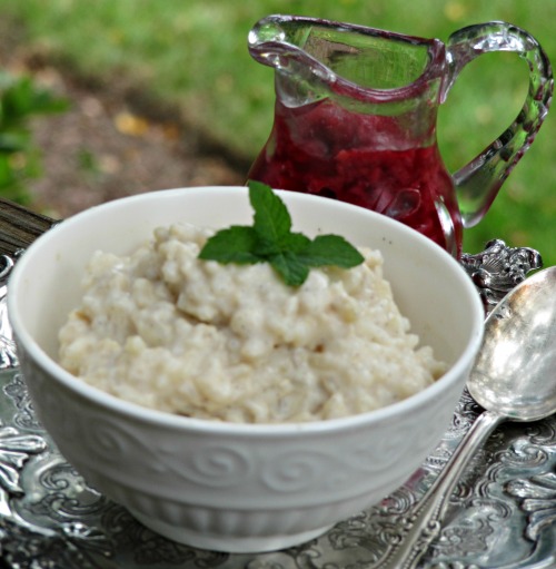 vanilla bean rice pudding raspberry compote in a pitcher. 