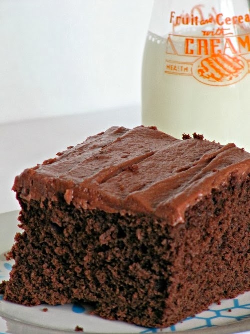 chocolate snack cake with a bottle of milk.