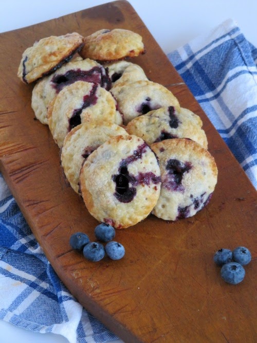 blueberry pies on a cutting board. 