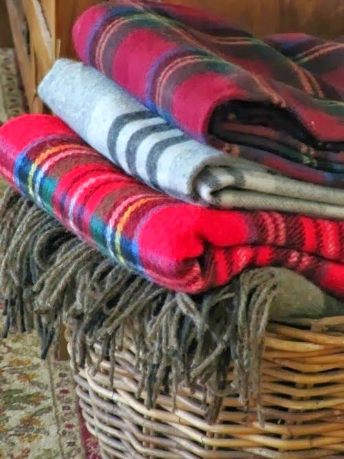 Tartan blankets in a basket. 