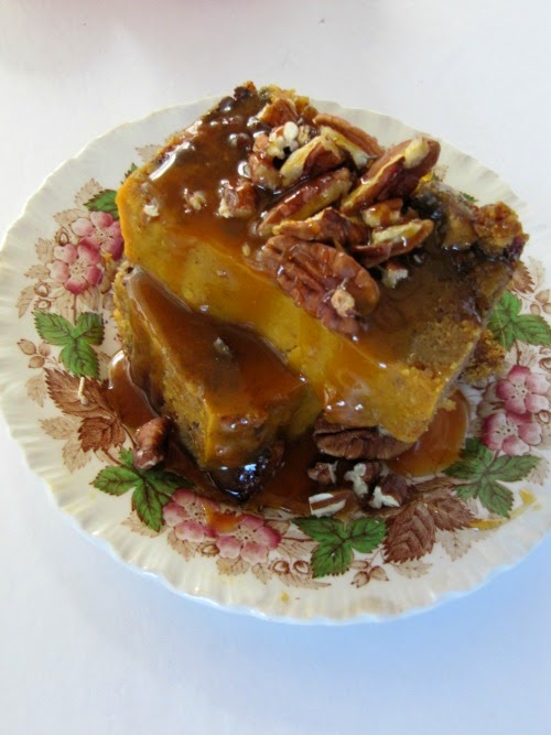 Pumpkin Bread Pudding with Salted Caramel Sauce and Toasted Pecans stacked on top of one another. 