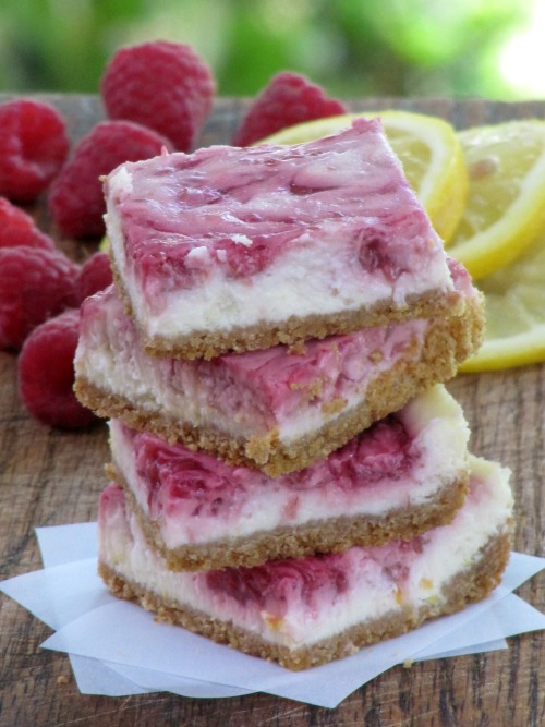 a stack of raspberry lemon cheesecake bars