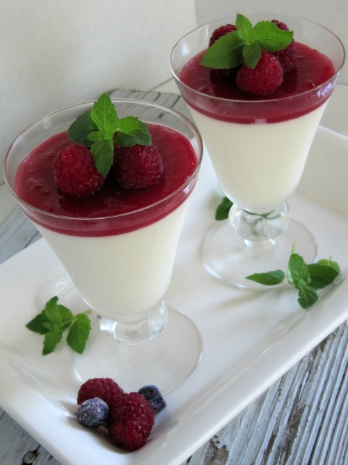 Swedish Cream with Raspberry Sauce and mint leaves.