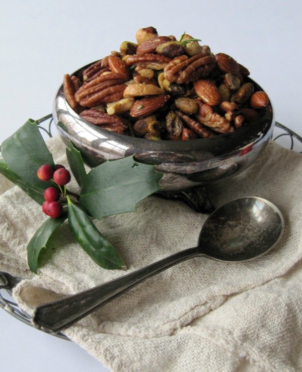 A silver bowl of mixed bar nuts.