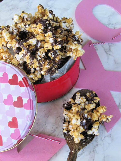 Chocolate Drizzled Carmel Corn in a tin with pin xoxo.