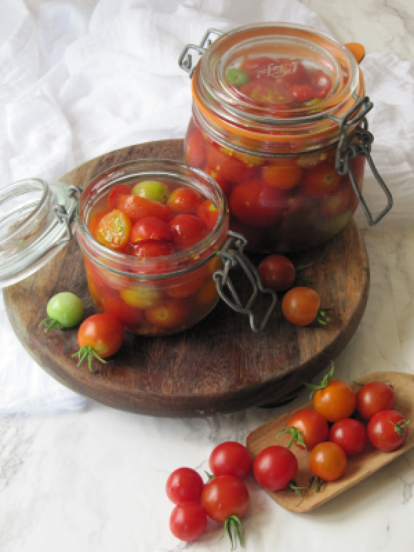 pickled tomatoes in jars.