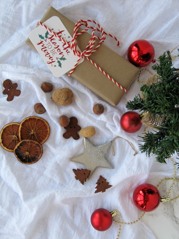 Christmas gifts with small tree ornaments and nuts
