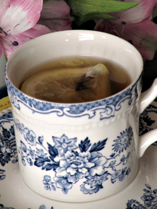 Lemon floating in a cup of water