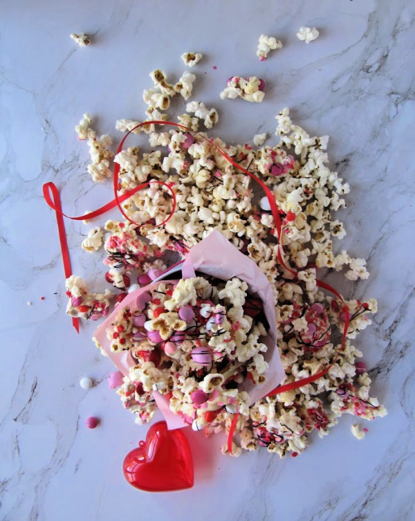 Chocolate covered popcorn with valentines candy