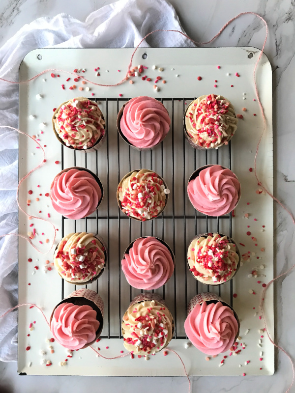 Valentine chocolate white and pink cupcakes on a white tray