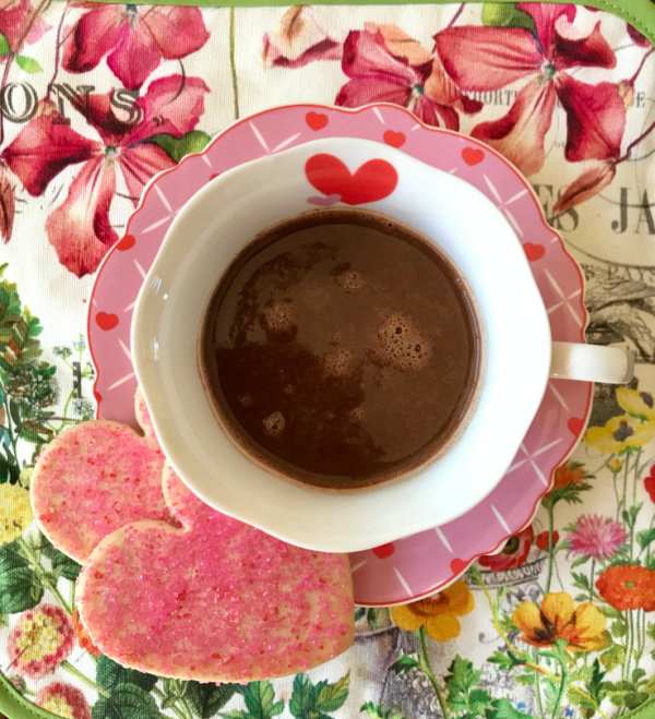 Cup of hot chocolate with heart shaped cookies