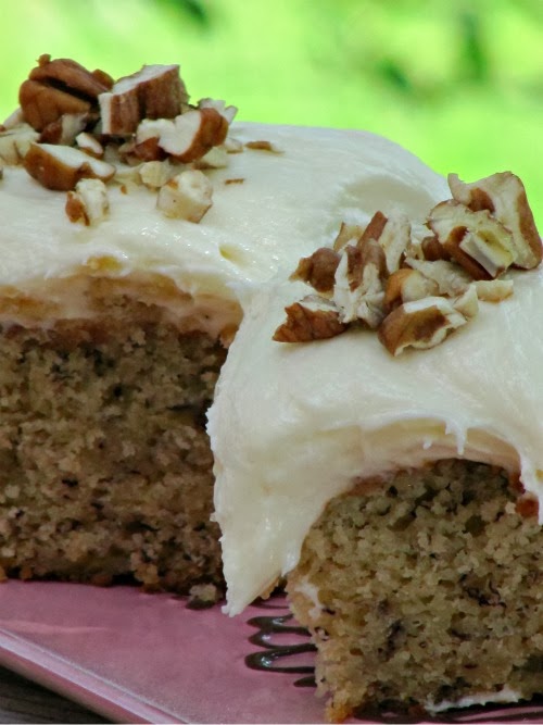banana cake with cream cheese frosting with pecans