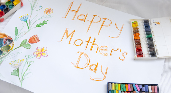 5 Homemade Mother's Day Gift Ideas, a homemade card that says happy mothers day and a box of crayons alongside. 