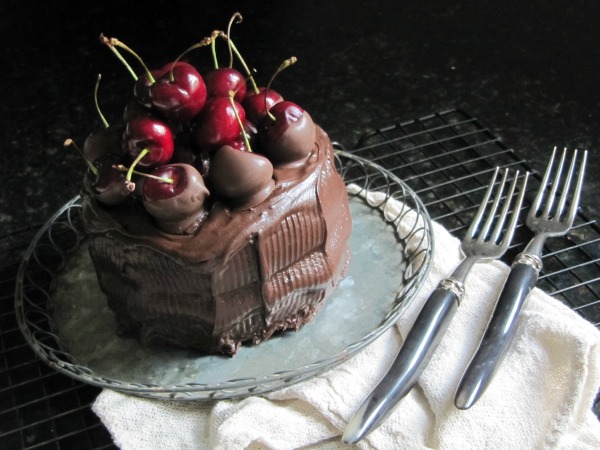 chocolate cake with chocolate covered cherries. 