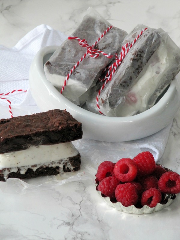 brownie ice-cream-sandwich with raspberries.