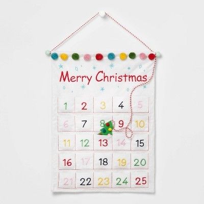 White Wall Calendar with colorful pom poms 