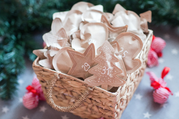 Basket of brown paper wrapped gifts with numbers