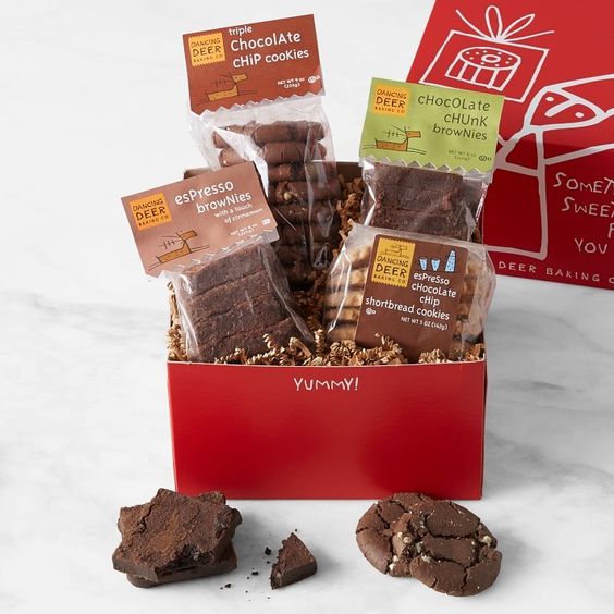 red box filled with 4 clear bags of cookies and brownies