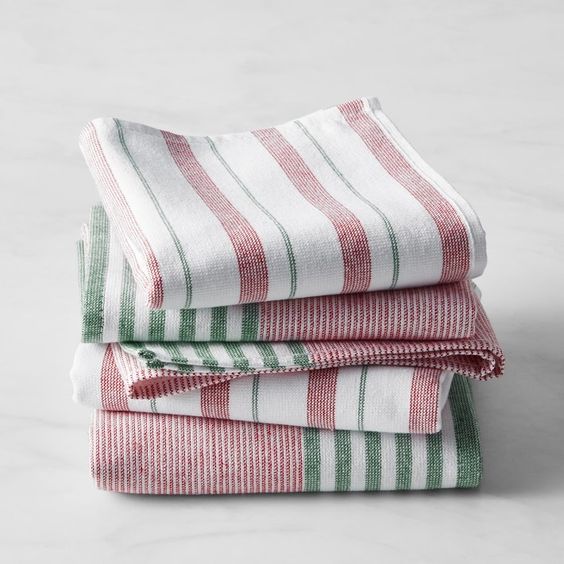 A stack of red and white and green and white kitchen towels