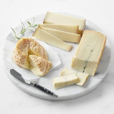French cheese on marble tray with knife