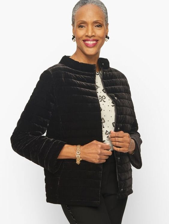 woman in a black quilted velvet jacket