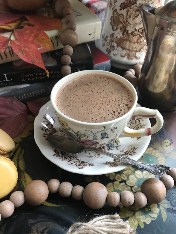 hot chocolate in vintage transfer ware in a tole tray with fall leaves