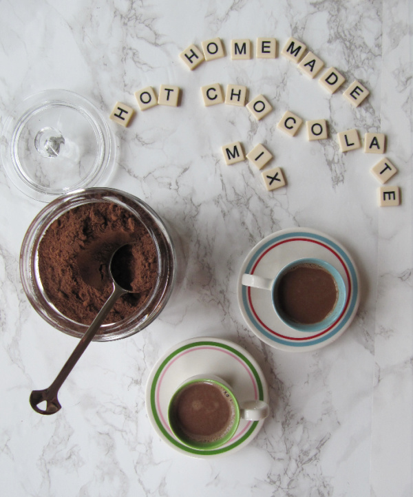 brave tart homemade hot chocolate mix written in scrabble tiles and two cups of cocoa