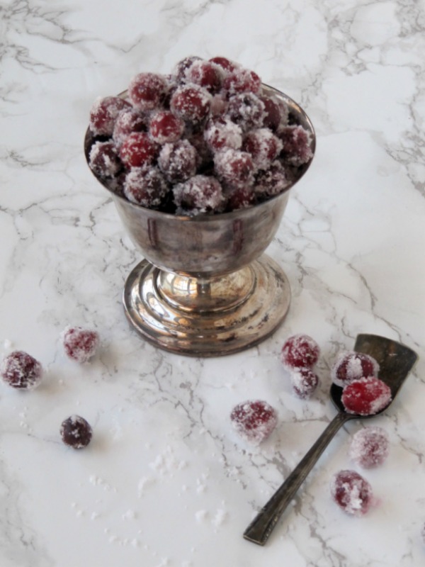 Candied cranberries in a silver bowl