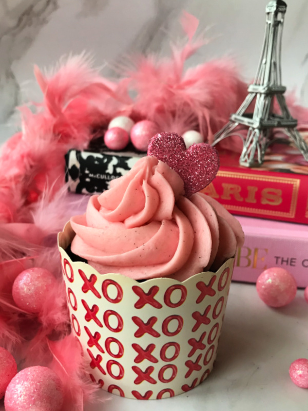 Valentine-cupcake-in-front-of-stanck-of-books
