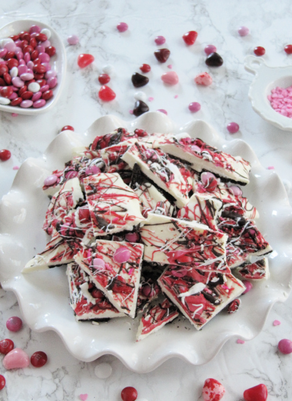 chocolate oreo bark candy on a white ruffled tray