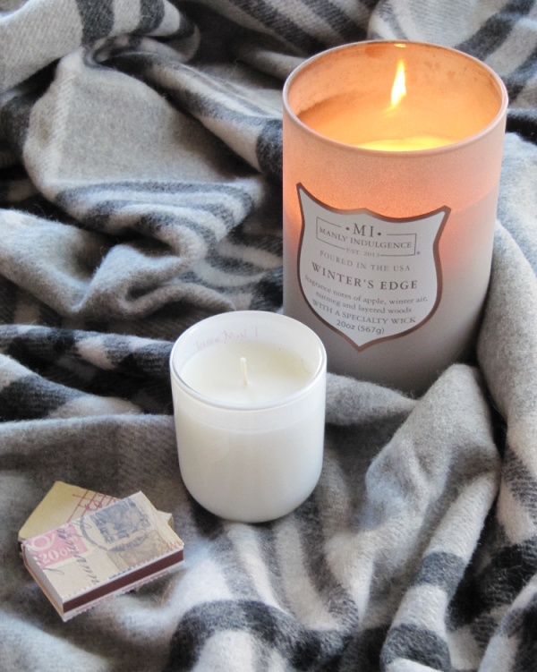gray black and white plaid Ralph Lauren throw with two candles and two boxes of matches