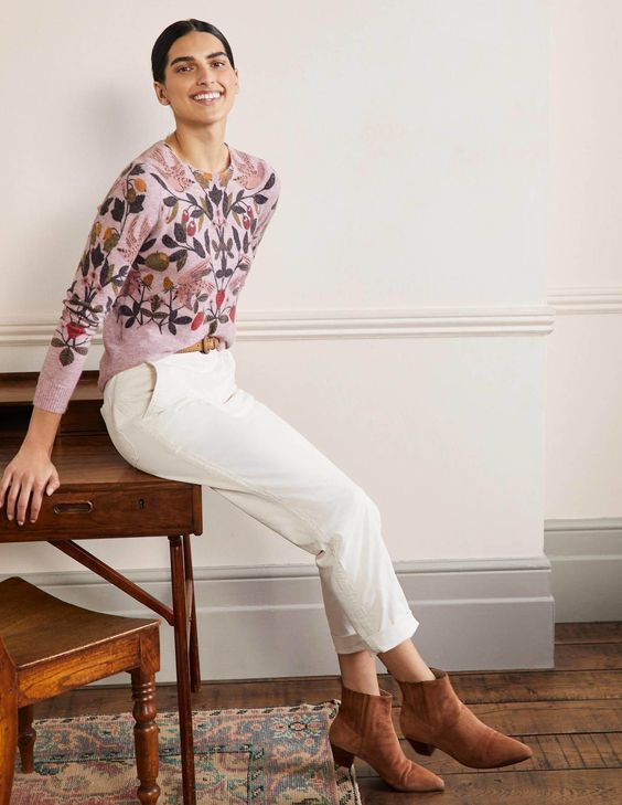 Woman in white pants with a pink sweater Boden