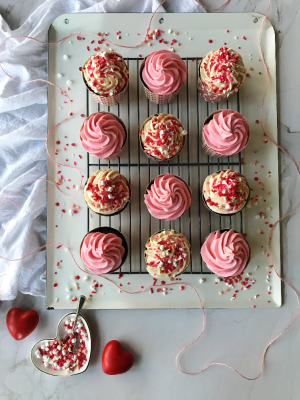 Chocolate-cupcakes-with-pink-buttercream-frosting-pink and white and colorful valentines day sprinkles