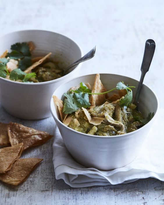 2 white bowls of chili verde