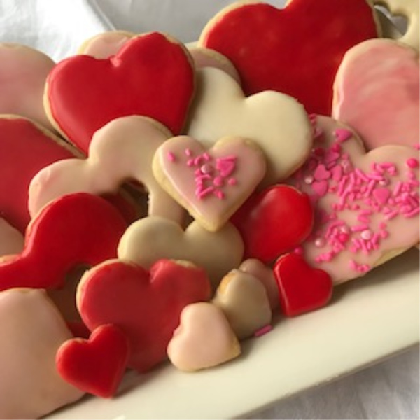 heart shaped sugar cookies in shades of red, pink and white