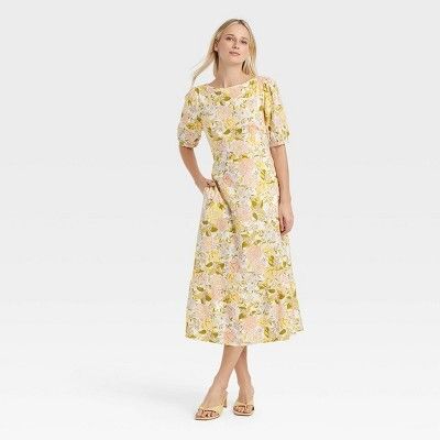 Woman wearing aFriday Favorites find yellow dress with flowers