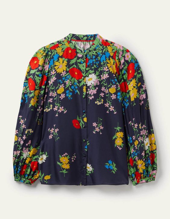 blue long sleeved shirt with red yellow and green flowers