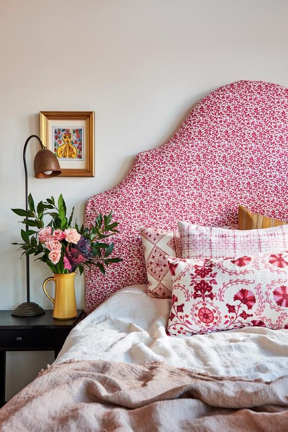 Fuchsia pattern headboard with colorful pillows