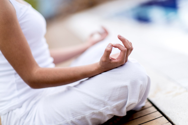 woman in white doing yoga, 100 Ways to Have a Cozy Winter Reset