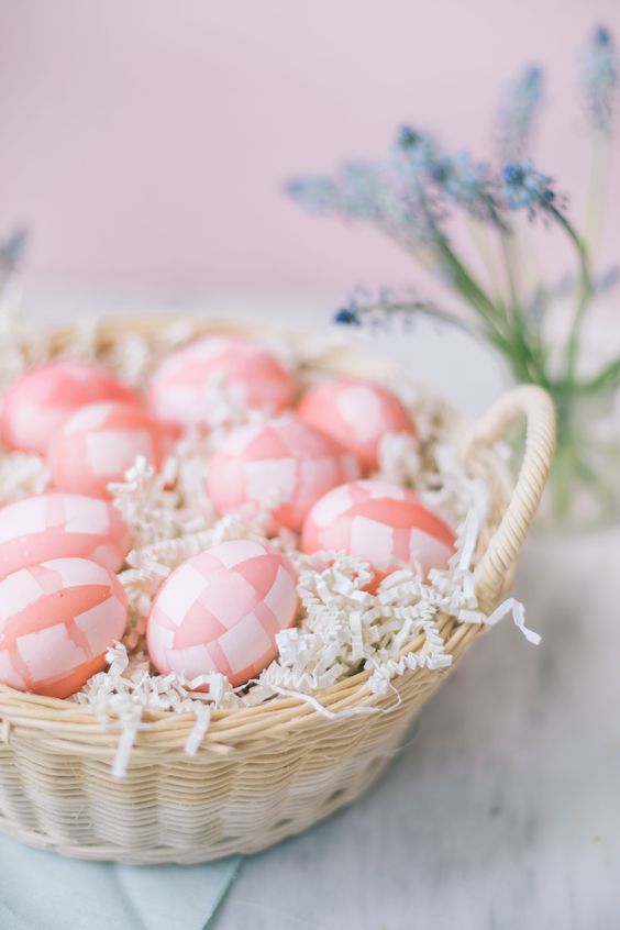 pink and white check eggs in a basket