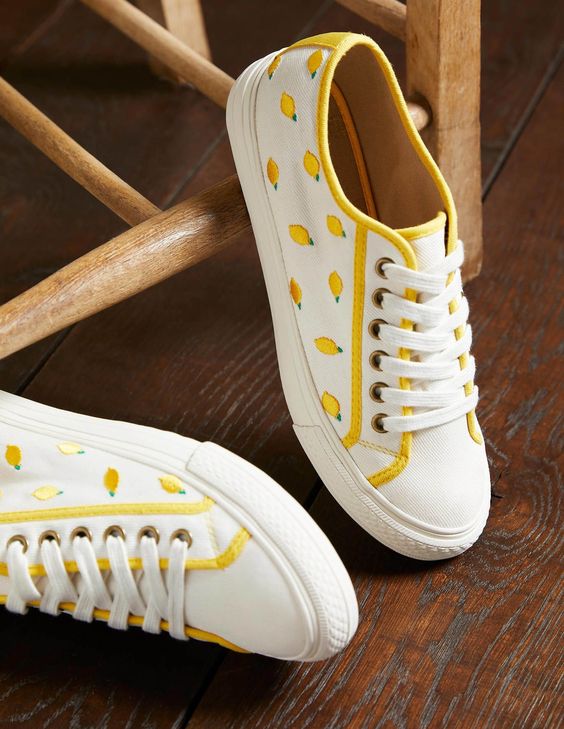 white tennis shoes with lemons bodes