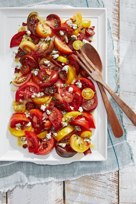 friday favorites white platter of tomatoes with bacon dressing