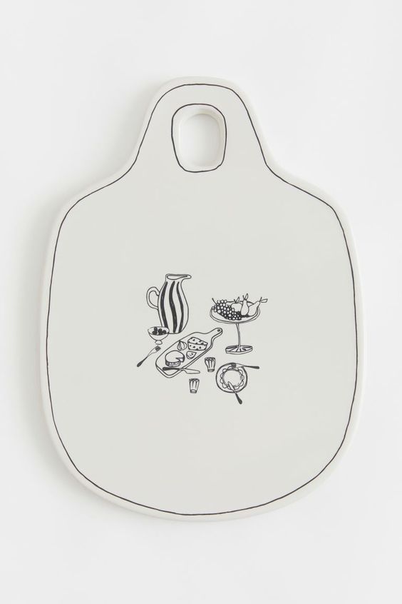 white cheese board with black outline and images of cheese and cocktails in the center HM