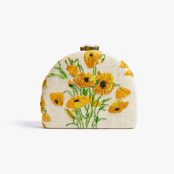 small white wicker handbag with yellow and green flowers