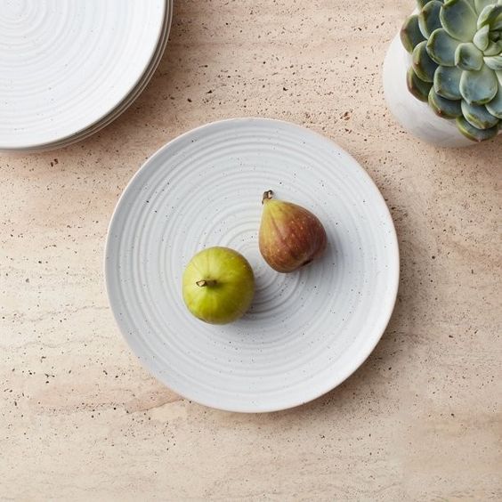 white stoneware plates with a pair of pears