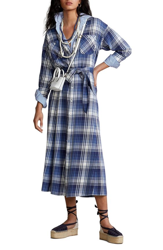 woman in a blue plaid dress