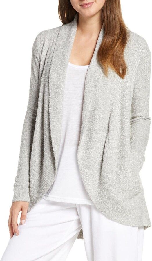 Friday Favorites woman wearing a white shirt and pants with a gray cardigan